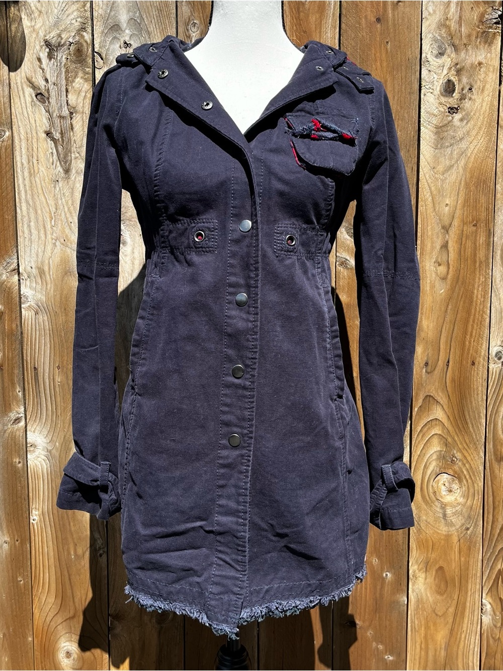 Free People Navy Hooded Utility Trench Coat with a red plaid hoodie